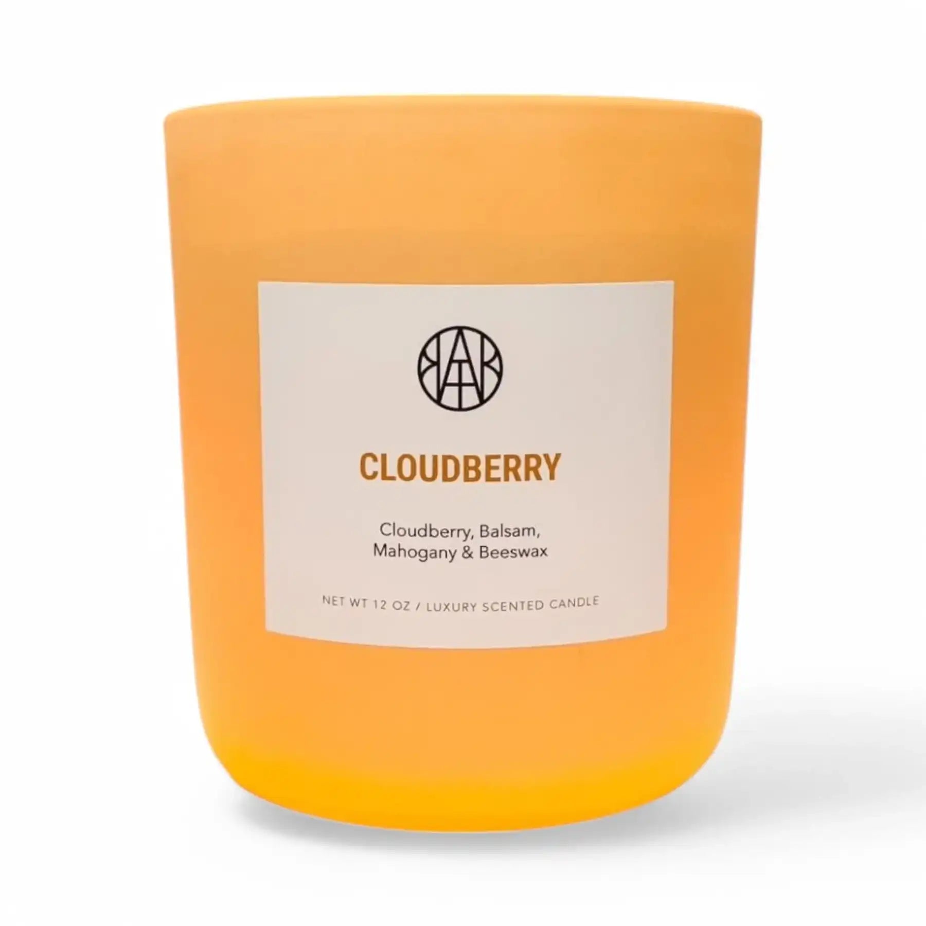 AEMBR Cloudberry luxury scented candle in frosted orange glass jar with label, home fragrance