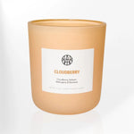 AEMBR Cloudberry luxury scented candle with clean label, non-toxic, peach matte jar.