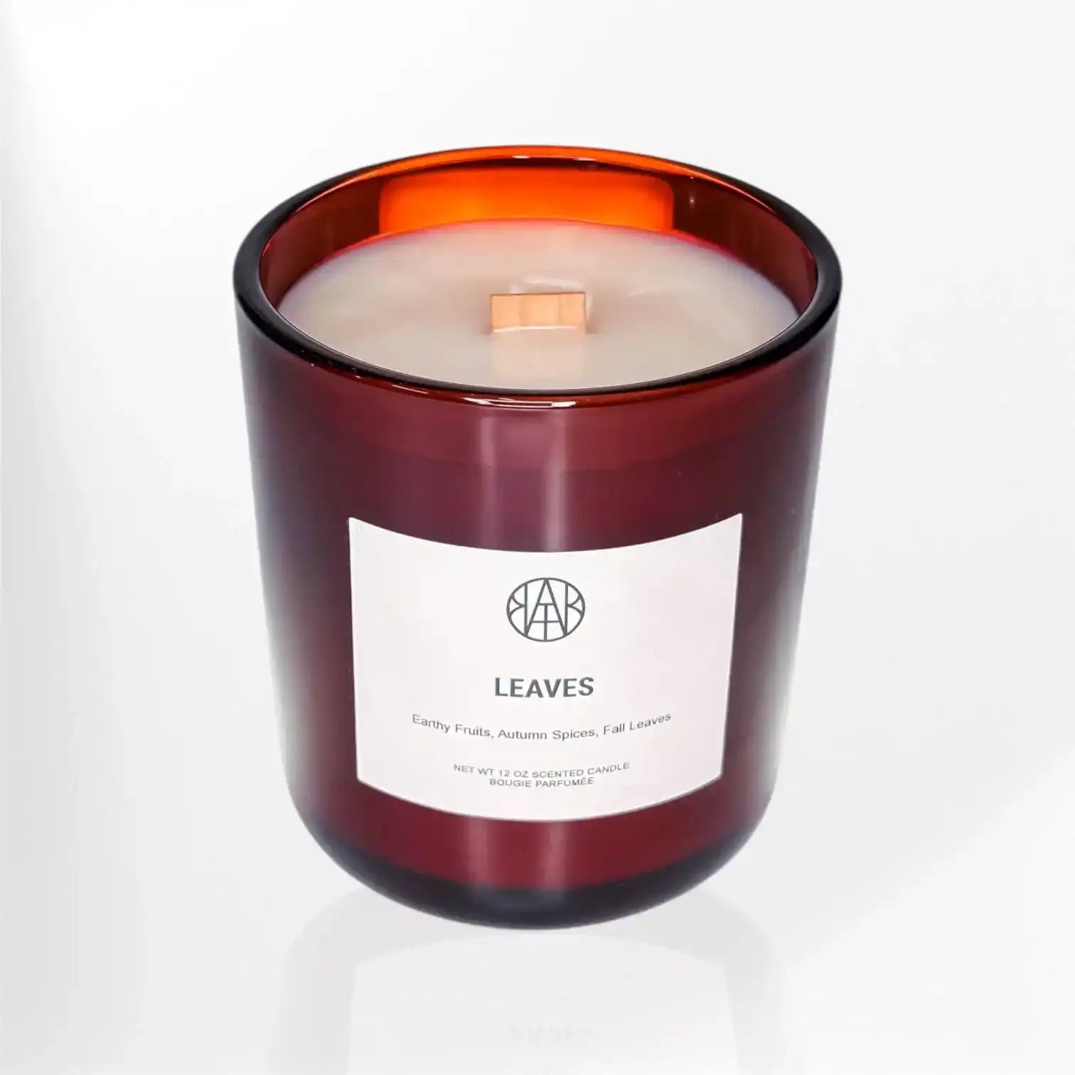 AEMBR Leaves scented candle in amber glass jar with wooden wick on white background