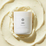 AEMBR LIMON Limoncello & Crème candle on creamy textured background, non-toxic home fragrance
