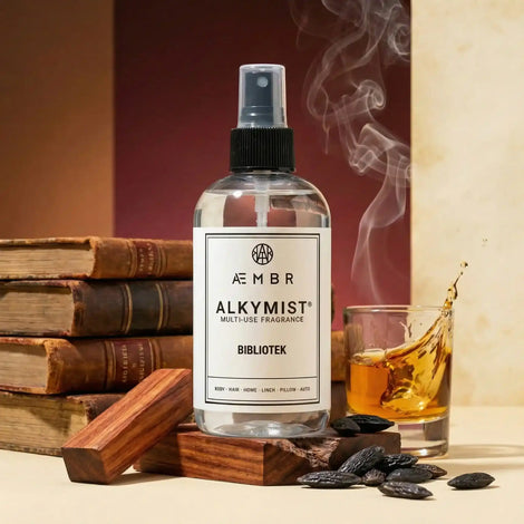 AEMBR non-toxic multi-use fragrance spray bottle with books, wood, spices, and glass of whiskey