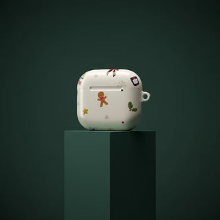 White ceramic piggy bank with Christmas-themed designs on a dark green pedestal against a dark green background