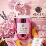 AEMBR Love Spell candle, laundry powder, and wax melt with cherry blossom, peach, and lavender.