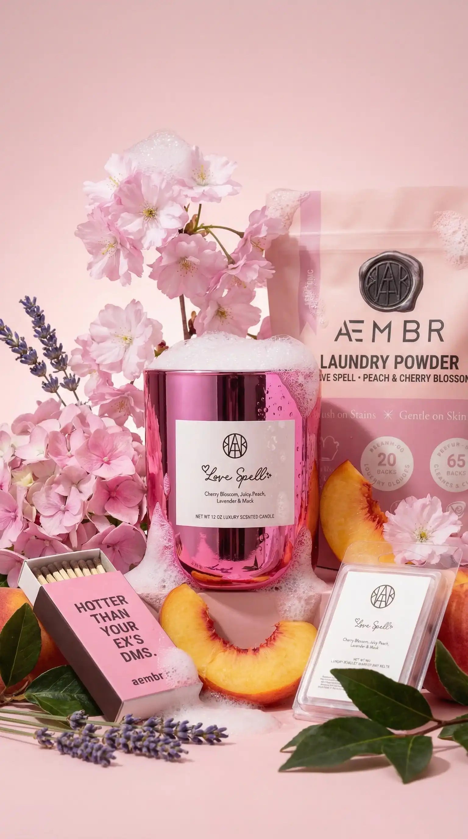 AEMBR Love Spell candle, laundry powder, and wax melt with cherry blossom, peach, and lavender.