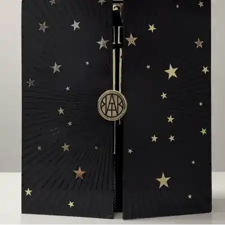 AEMBR black advent calendar box with gold stars and logo, luxury home gift packaging