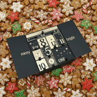 Luxury Advent Calendar 2025 by AEMBR featuring festive compartments and elegant design for holiday countdowns.
