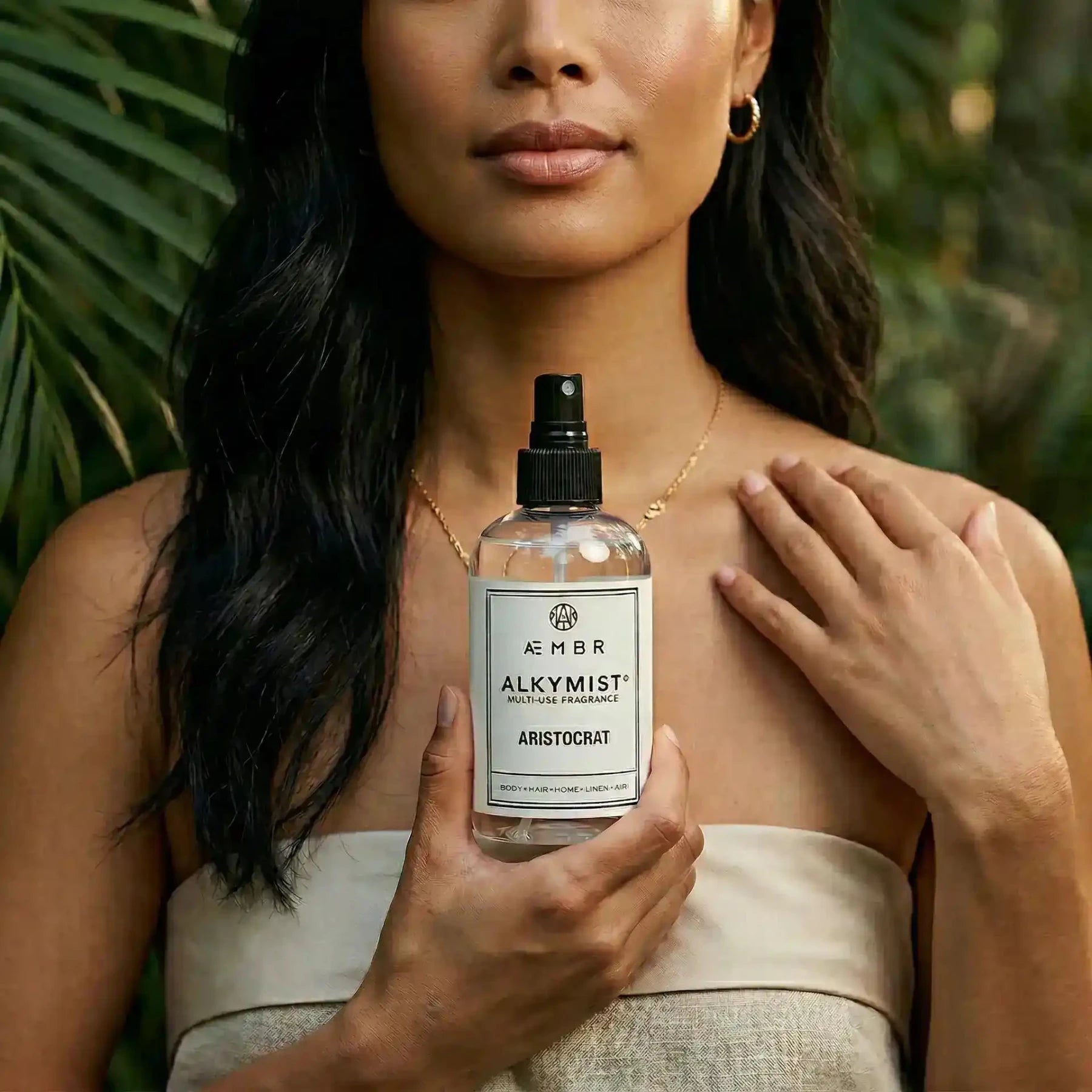 Alkymist® Aristocrat multi-use room spray by AEMBR, featuring a sleek bottle and elegant packaging for home fragrance.