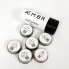 AEMBR New to AEMBR bundle featuring multiple skincare products with sleek packaging arranged together.