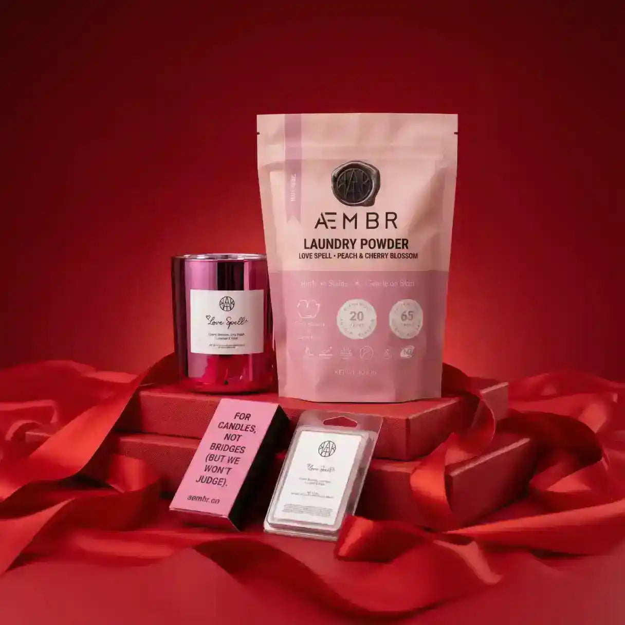 AEMBR Love Spell mini candle bundle featuring multiple scented candles with elegant packaging for romantic ambiance.