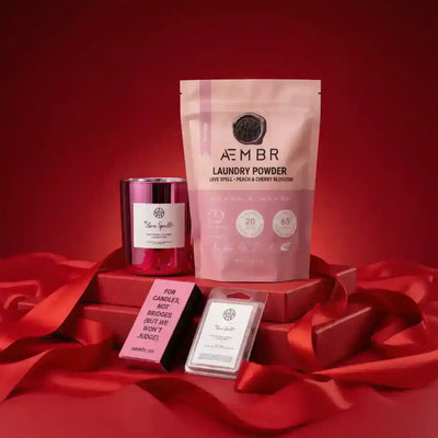 AEMBR Love Spell Mini Candle Bundle featuring three scented candles with romantic-themed packaging and designs.
