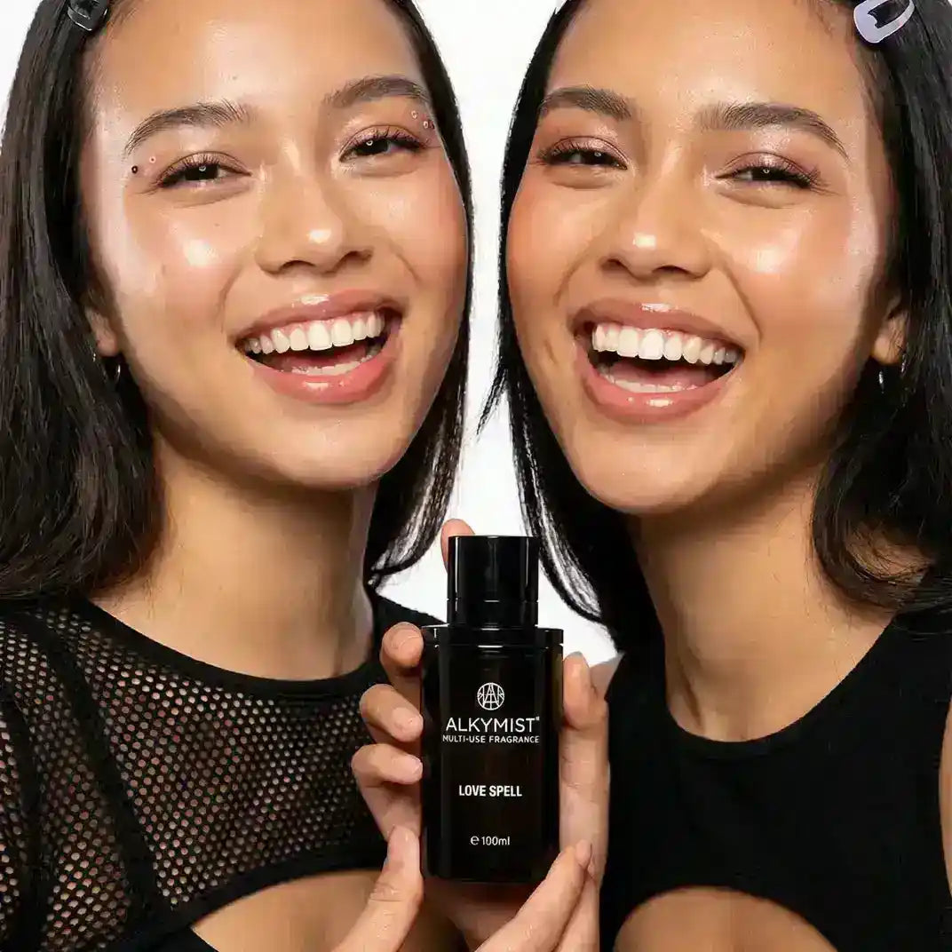 AEMBR ALKYMIST® Luxe Love Spell multi-use fragrance bundle with candle, detergent, and more in elegant packaging.