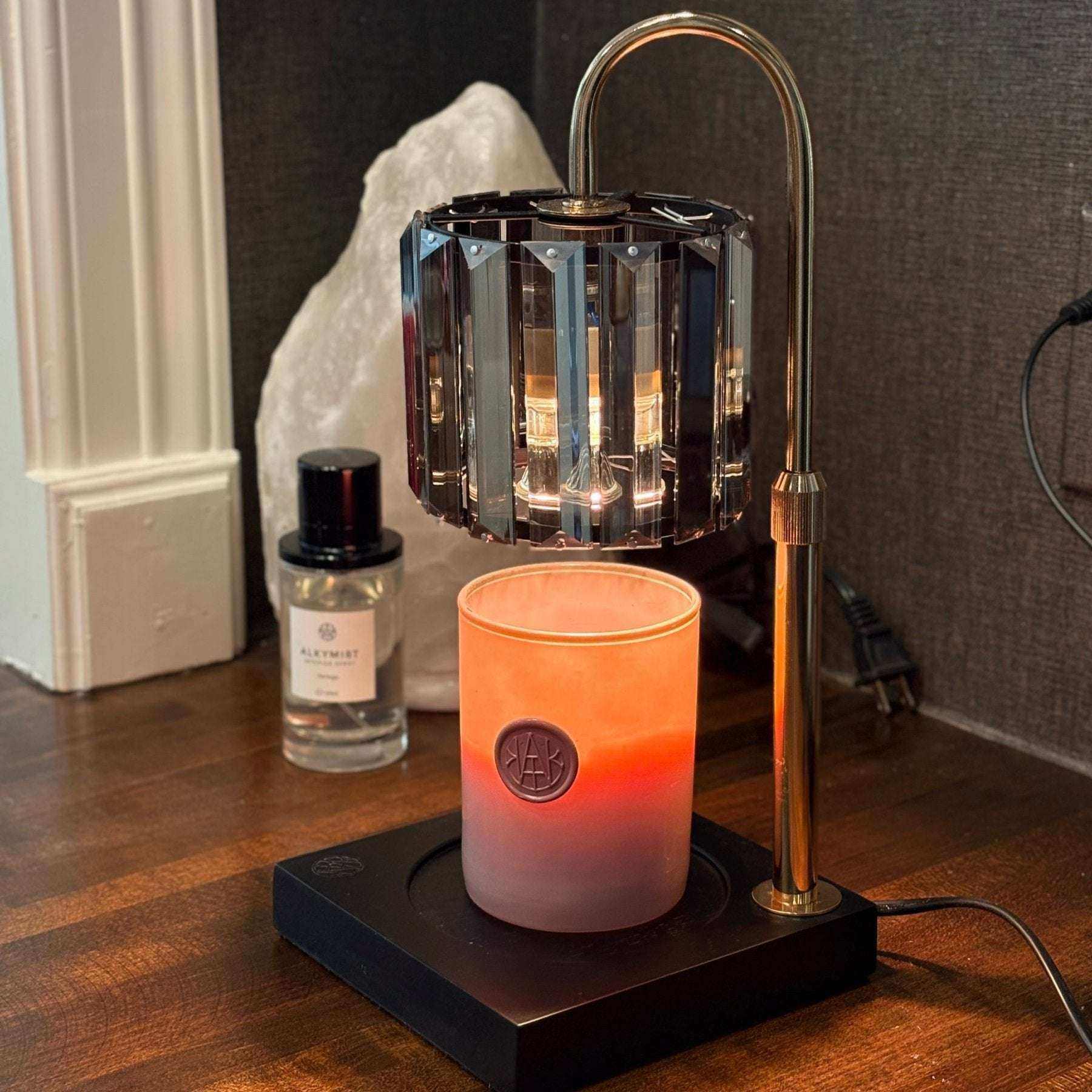 AEMBR Deco Candle Warmer showing a sleek, modern design with a decorative ceramic surface and a warming plate on top.