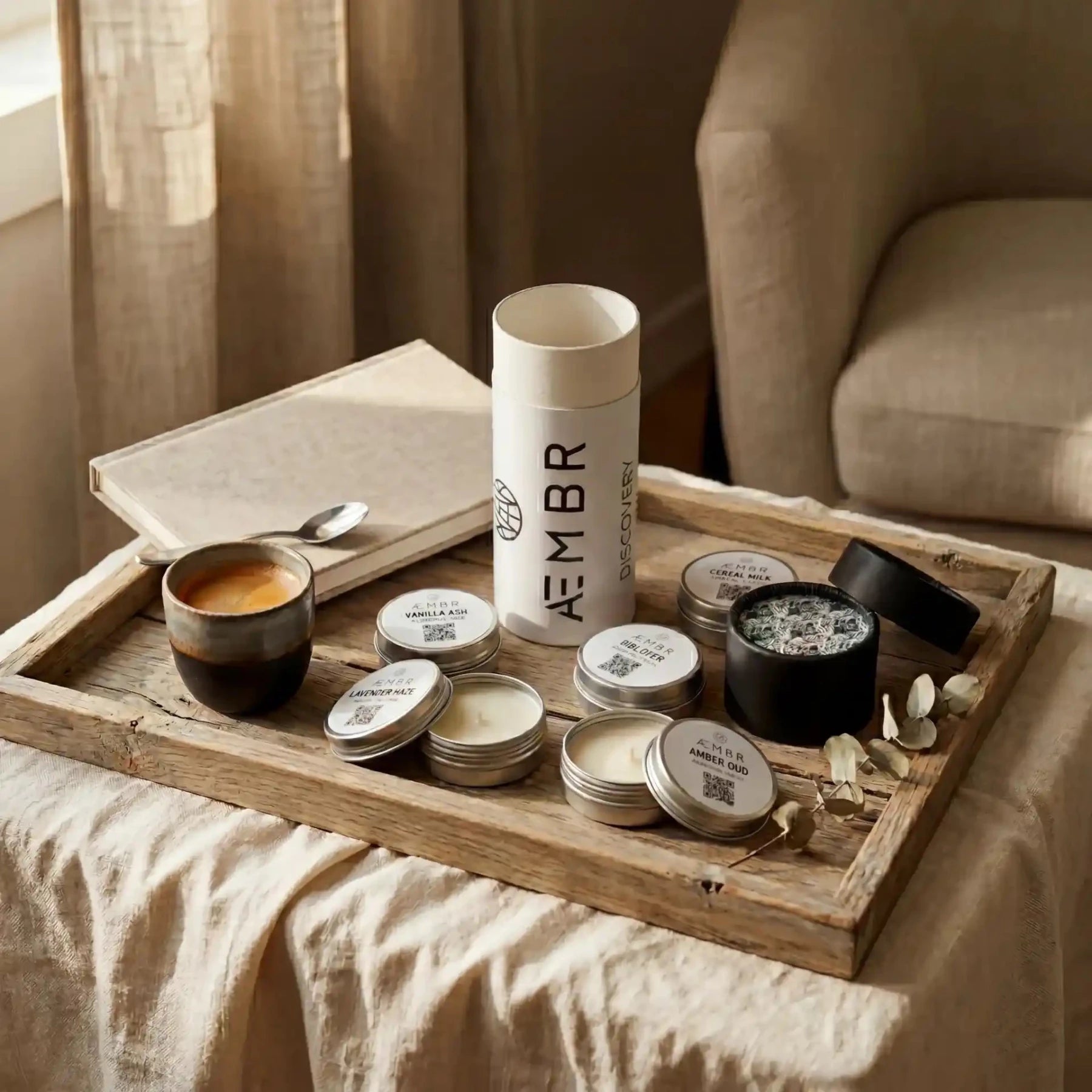 AEMBR Discovery Set of candles with four elegant, natural-colored candles in a minimalist gift box.