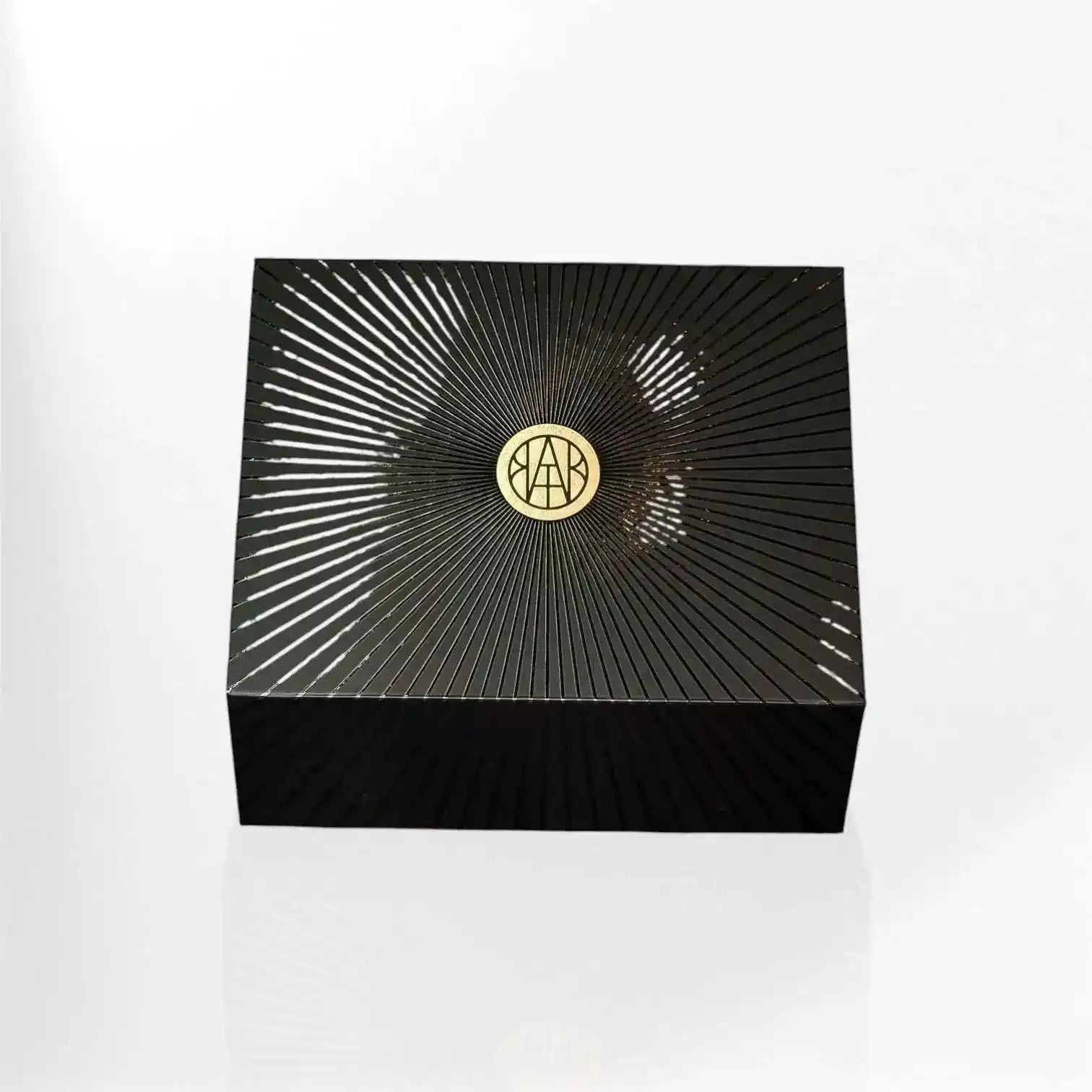 AEMBR candles in a gift set with various scents displayed, featuring elegant packaging and decorative elements.