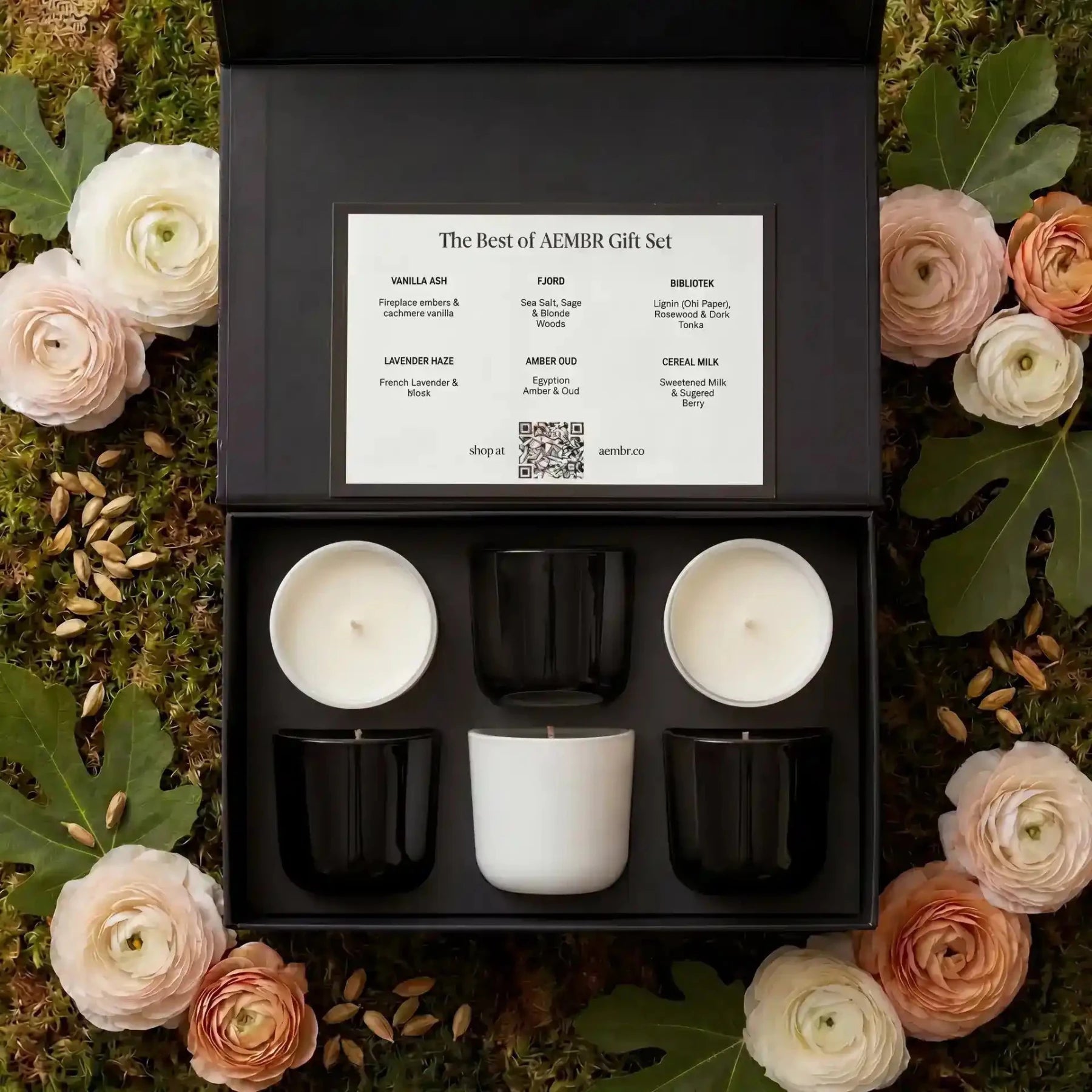 Set of AEMBR candles in the Best of AEMBR Gift Set, featuring multiple scented candles in elegant containers.