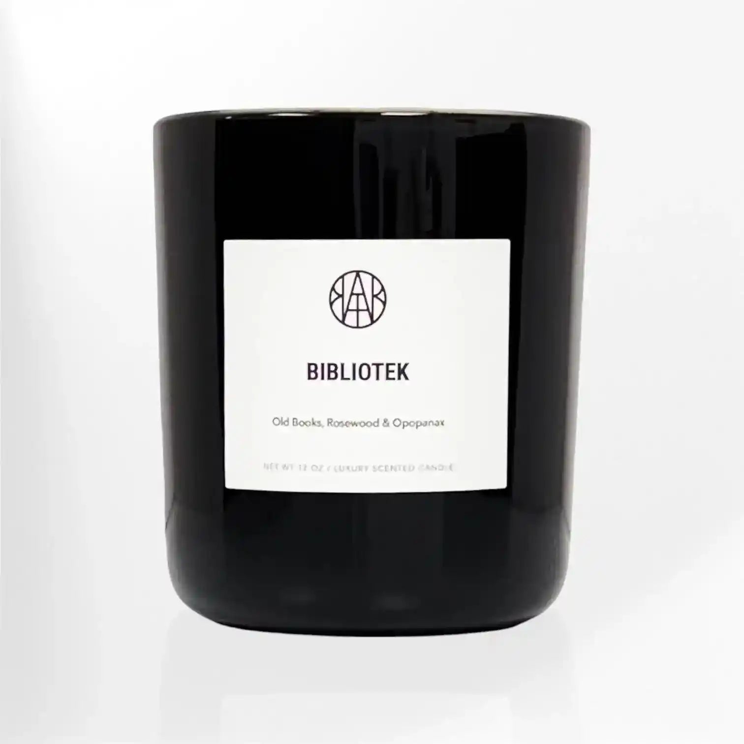 AEMBR Bibliotek Candle featuring a sleek, minimalist design with a white wax finish and a simple wooden wick.