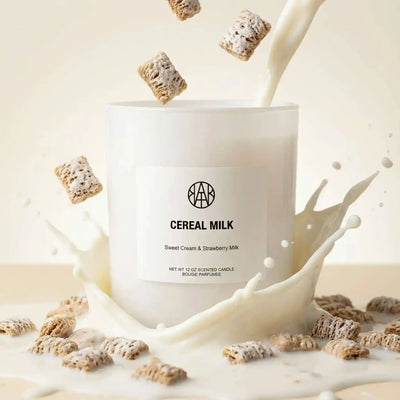 AEMBR Cereal Milk Candle with a white ceramic holder, featuring a cozy, milk and cereal scent, perfect for warm ambiance.