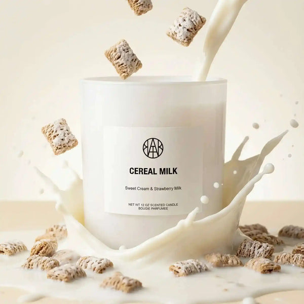 AEMBR Cereal Milk Candle with a white ceramic holder, featuring a cozy, milk and cereal scent, perfect for warm ambiance.