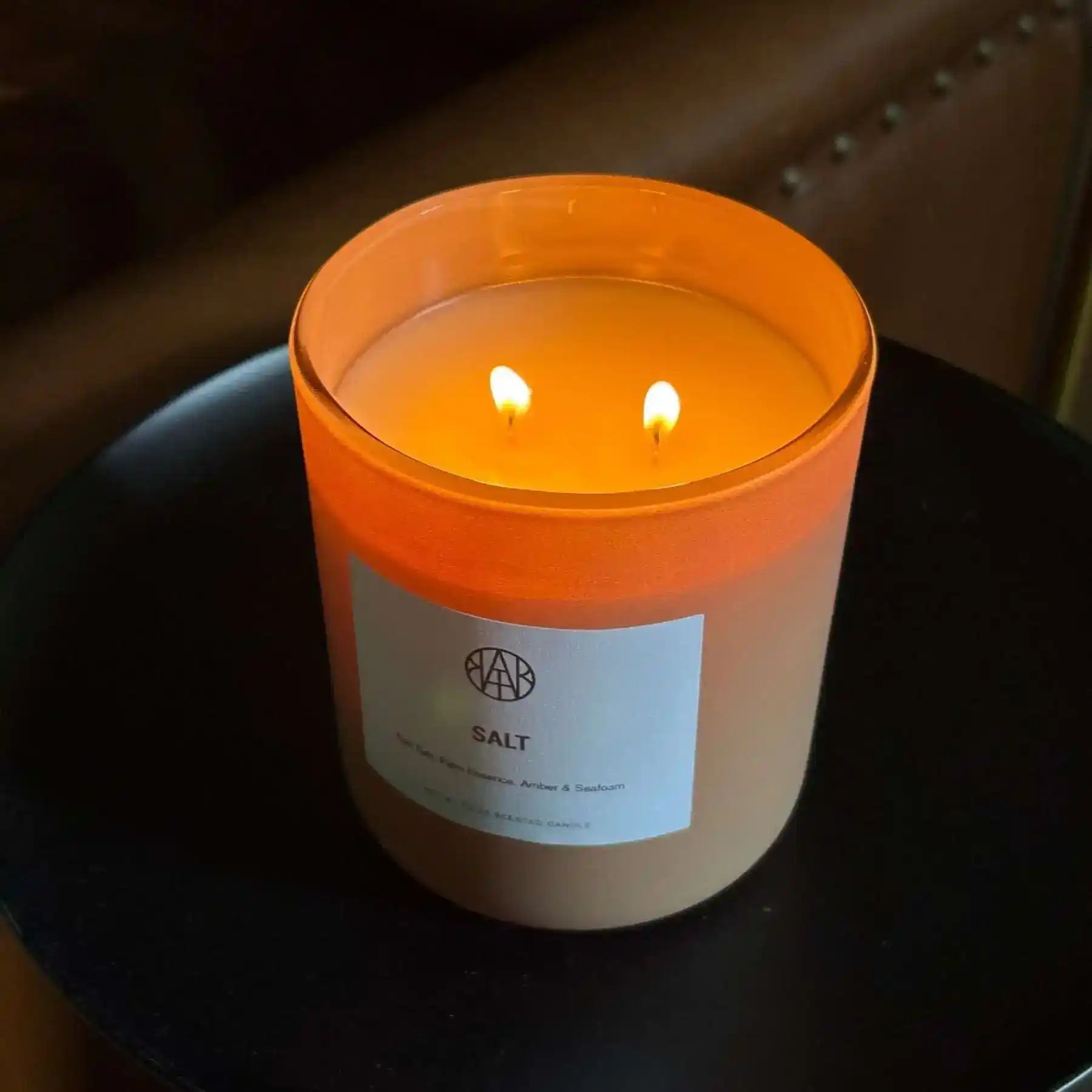 AEMBR citron candle, yellow scented candle in a glass holder, perfect for home decor and relaxing ambiance.