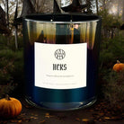 Set of Halloween-themed candles from AEMBR, featuring spooky designs perfect for seasonal decorating.