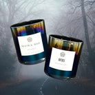 AEMBR Heks Candle with a sleek, modern design, showing a lit candle in a stylish holder on a neutral background.