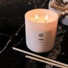AEMBR Limon Candle with fresh lemon scent, featuring a white wax candle in a clear glass jar, perfect for home decor and ambiance.