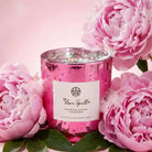 AEMBR Love Spell Candle with a sleek glass container and decorative label, perfect for romantic ambiance and aromatic use.