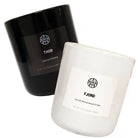 Two non-toxic scented candles, one black labeled Thor and one white labeled Fjord.