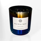 AEMBR Practical Magic Candle in a glass holder, featuring a sleek design and warm glow, perfect for ambient lighting and decoration.