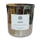 Non-toxic JULETID scented candle in metallic silver jar, Christmas spices and fir fragrance.