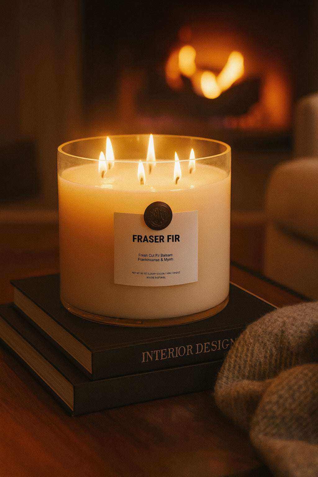 AEMBR The Valkyrie candle with Fraser Fir, Balsam, Frankincense, and Myrrh scents, featuring a decorative glass container.