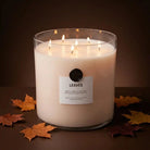 AEMBR The Valkyrie Leaves scented candle in a decorative jar, featuring green leaves and elegant design.