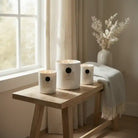 AEMBR The Viking Fjord candle featuring a dark, textured container with a rustic, Nordic-inspired design and a lit wick.