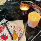 AEMBR Thor Candle featuring a sleek design and warm glow, perfect for adding ambiance to any space.
