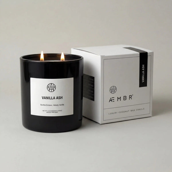 A vanilla ash candle by AEMBR with a sleek design, featuring a warm vanilla scent and a smooth, natural-colored wax finish.