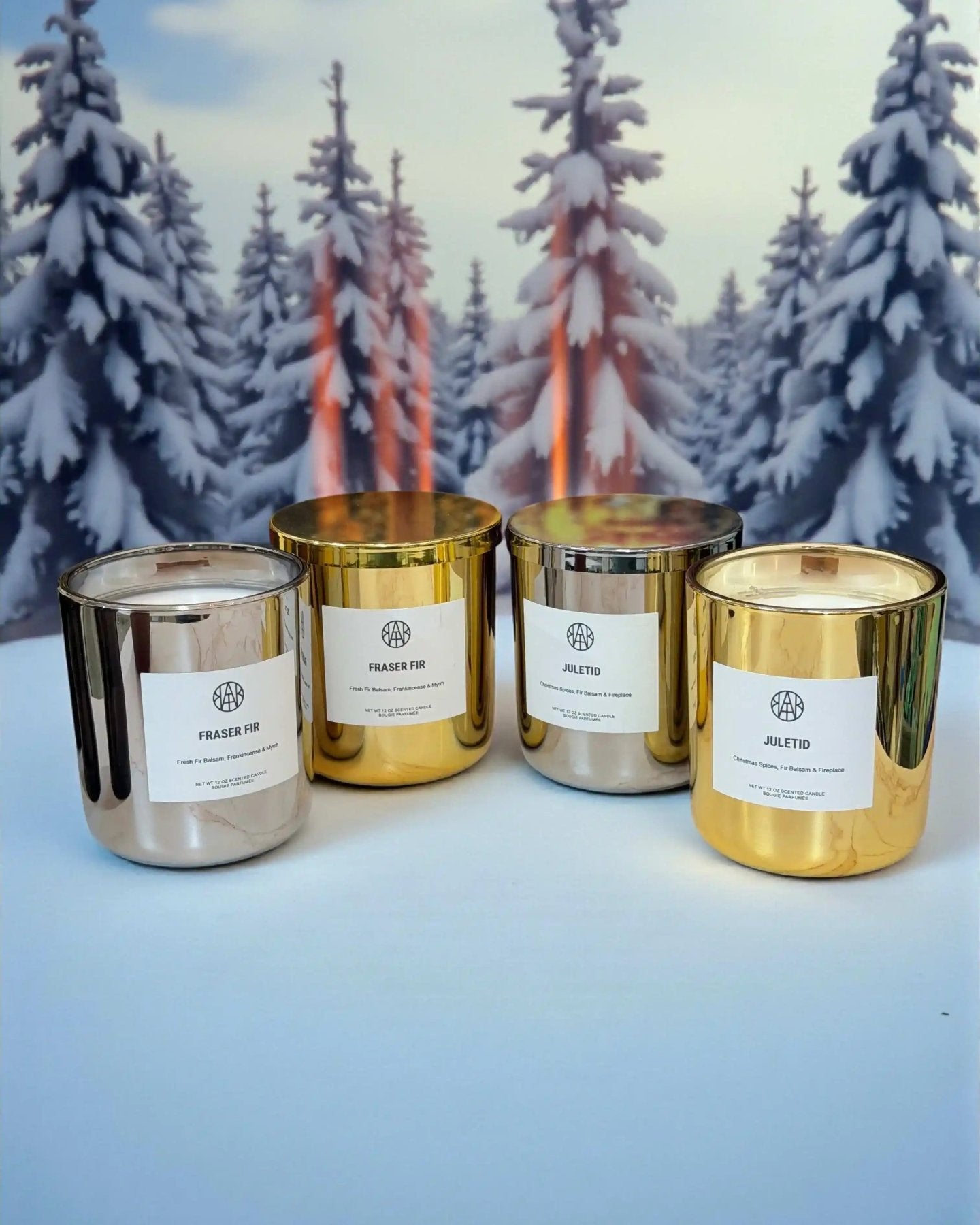 AEMBR Fraser Fir candles in Silver and Gold Editions, featuring festive candle designs with silver and gold accents.