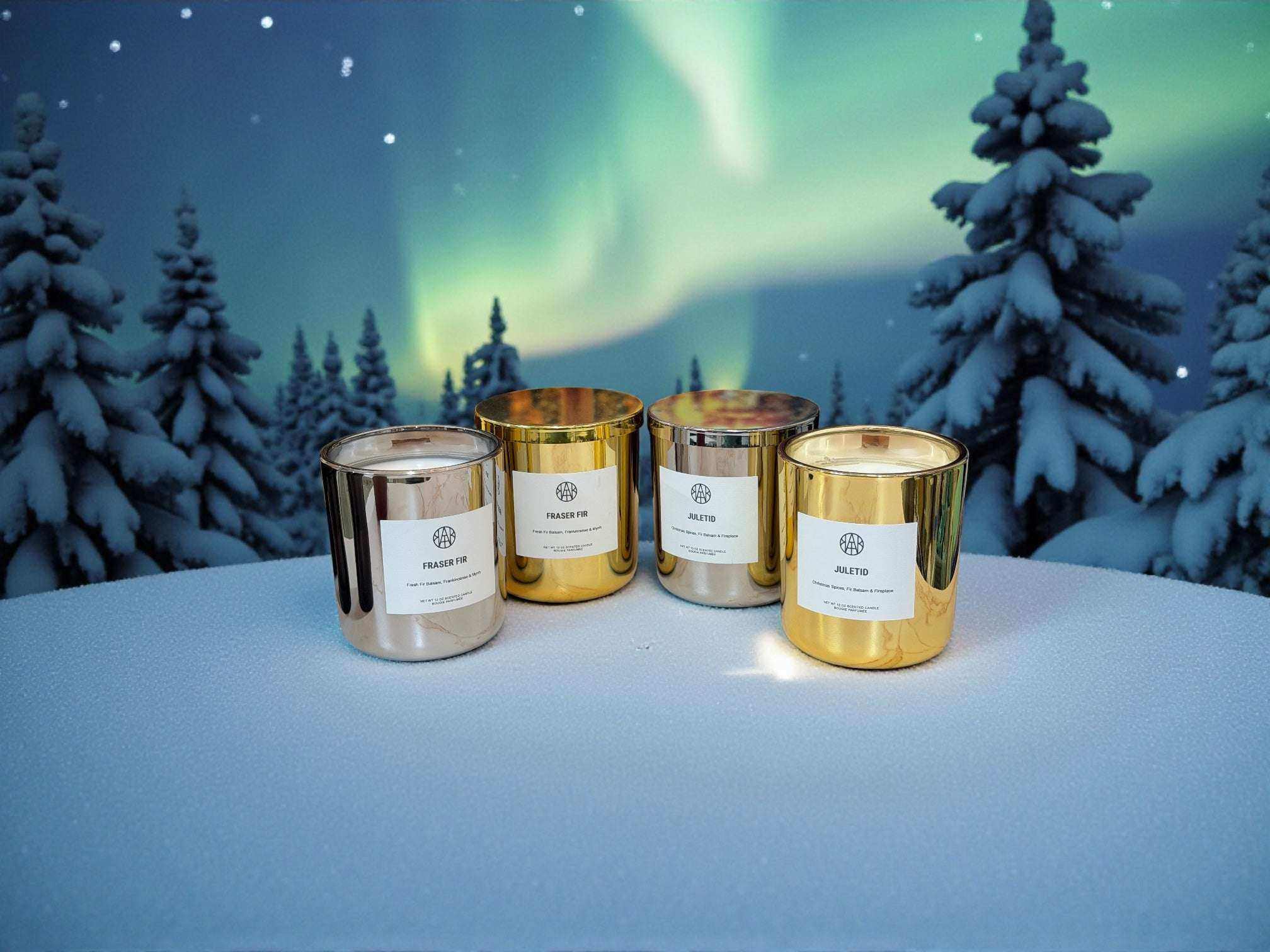 AEMBR Fraser Fir candles in Silver & Gold Editions with festive green and metallic accents, perfect for holiday decor.