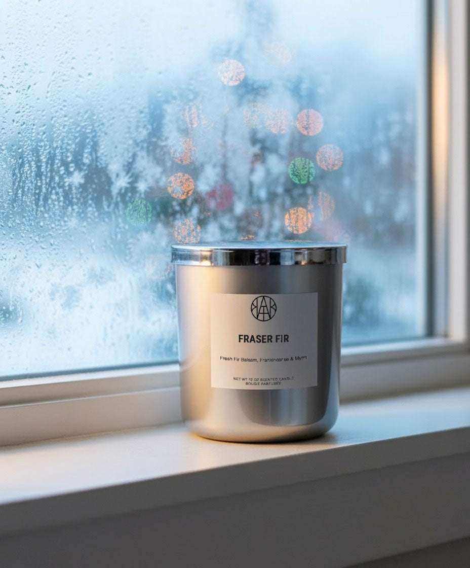 AEMBR Fraser Fir candles in Silver & Gold Editions with festive green and metallic accents, perfect for holiday decor.