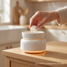 AEMBR Cereal Milk Wax Melt In Use - Hand Placing Wax Melt Into Electric Warmer - Flame-Free Home Fragrance - Up to 96 Hours