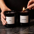 Father's Day Candle Set — In-Use Lifestyle — Lighting the Old Fashioned & Tuxedo candles on dark marble