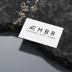 AEMBR instant gift card on textured stone surface, modern minimalist design, home gift idea