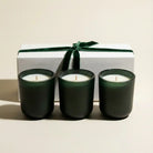 AEMBR Winter Votive Trio Gift Set with three decorative winter-themed candles in glass holders, perfect for holiday decor.