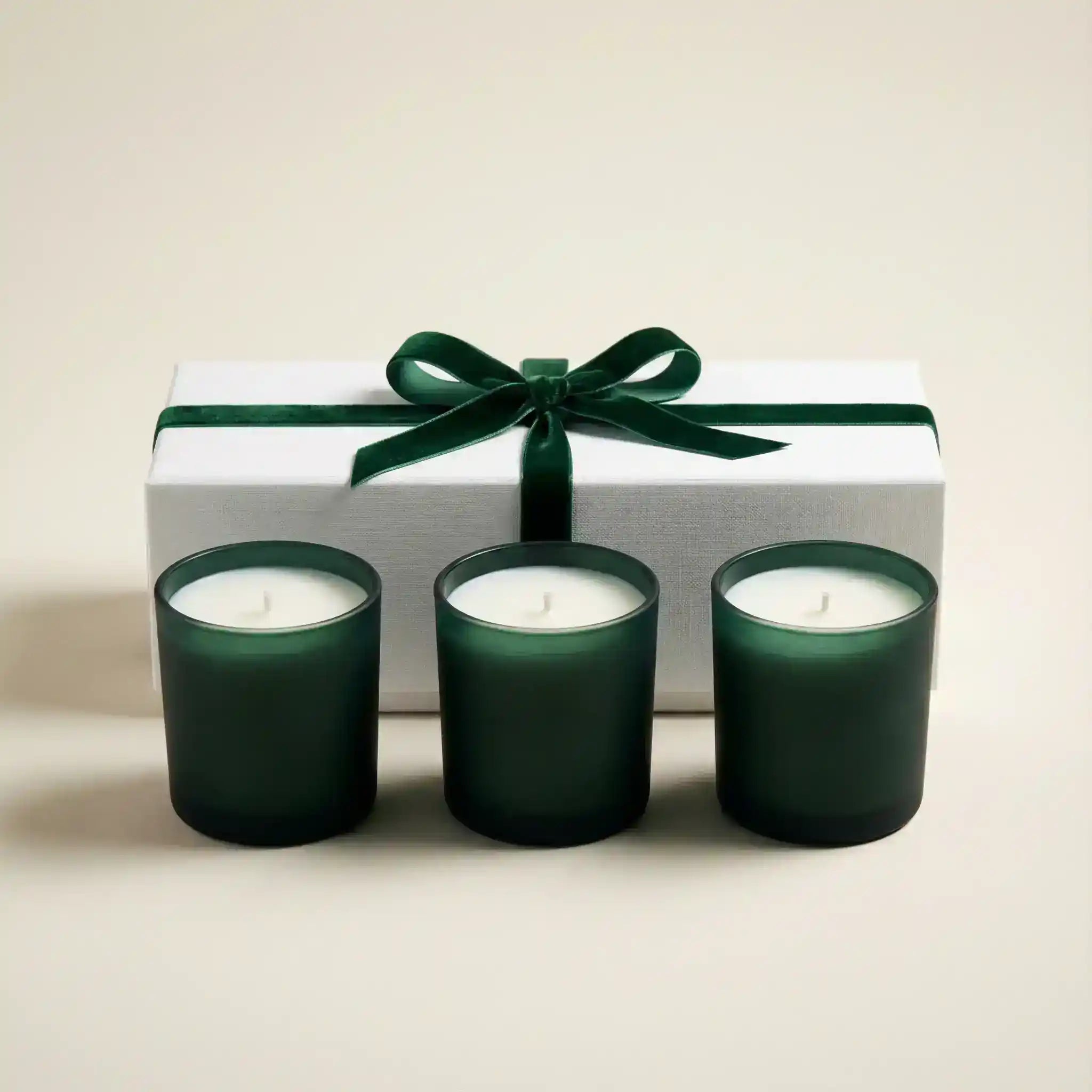 AEMBR Winter Votive Trio Gift Set featuring three decorative votive candles in festive holders.