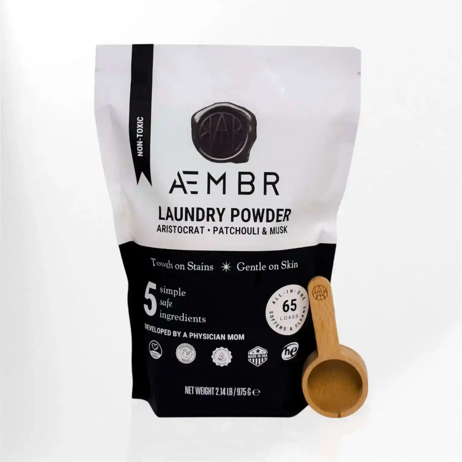 AEMBR laundry powder and scoop combo bundle featuring a patchouli musk scent and clean laundry image