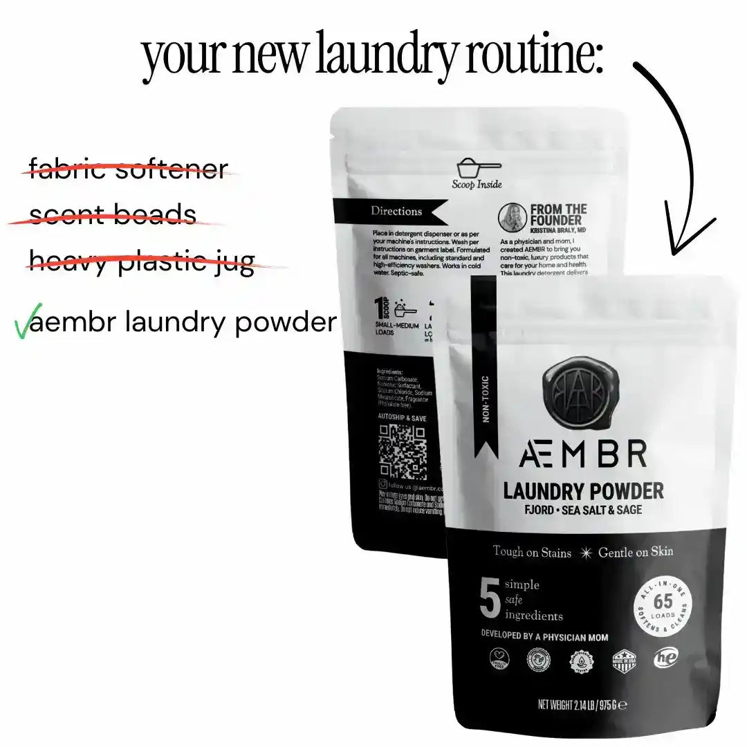 AEMBR luxury laundry gift set with scented bottles in fjord sea salt, sage, blonde woods, and elegant packaging.