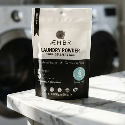 AEMBR Laundry Powder Trial Pack in Fjord scent, featuring a white detergent box with blue accents and product label.