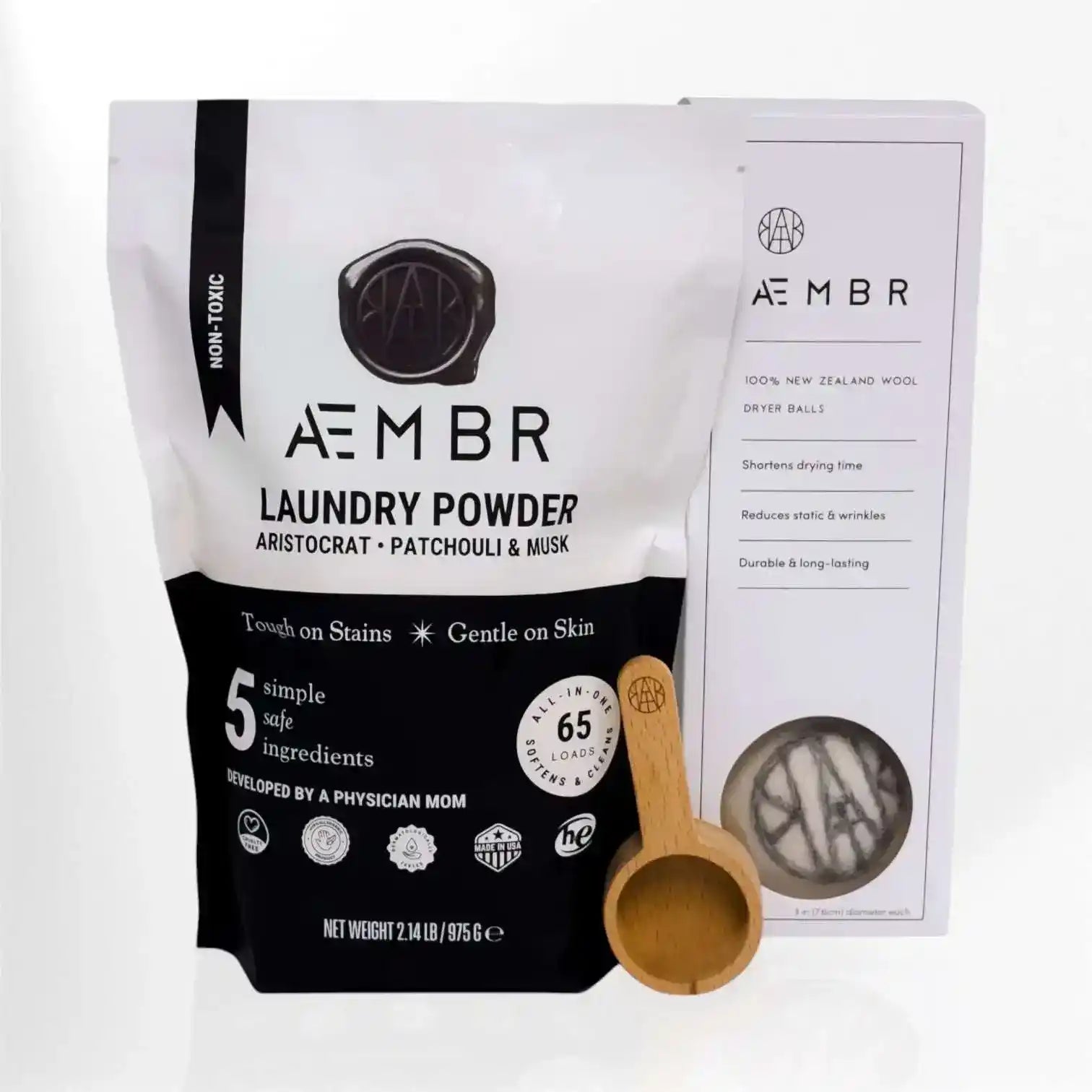 Non-toxic laundry care kit with laundry powder, wool dryer balls, and wooden scoop
