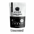 AEMBR laundry detergent powder in Fjord Sea Salt scent, featuring natural ingredients, in a white bag with blue and green accents.