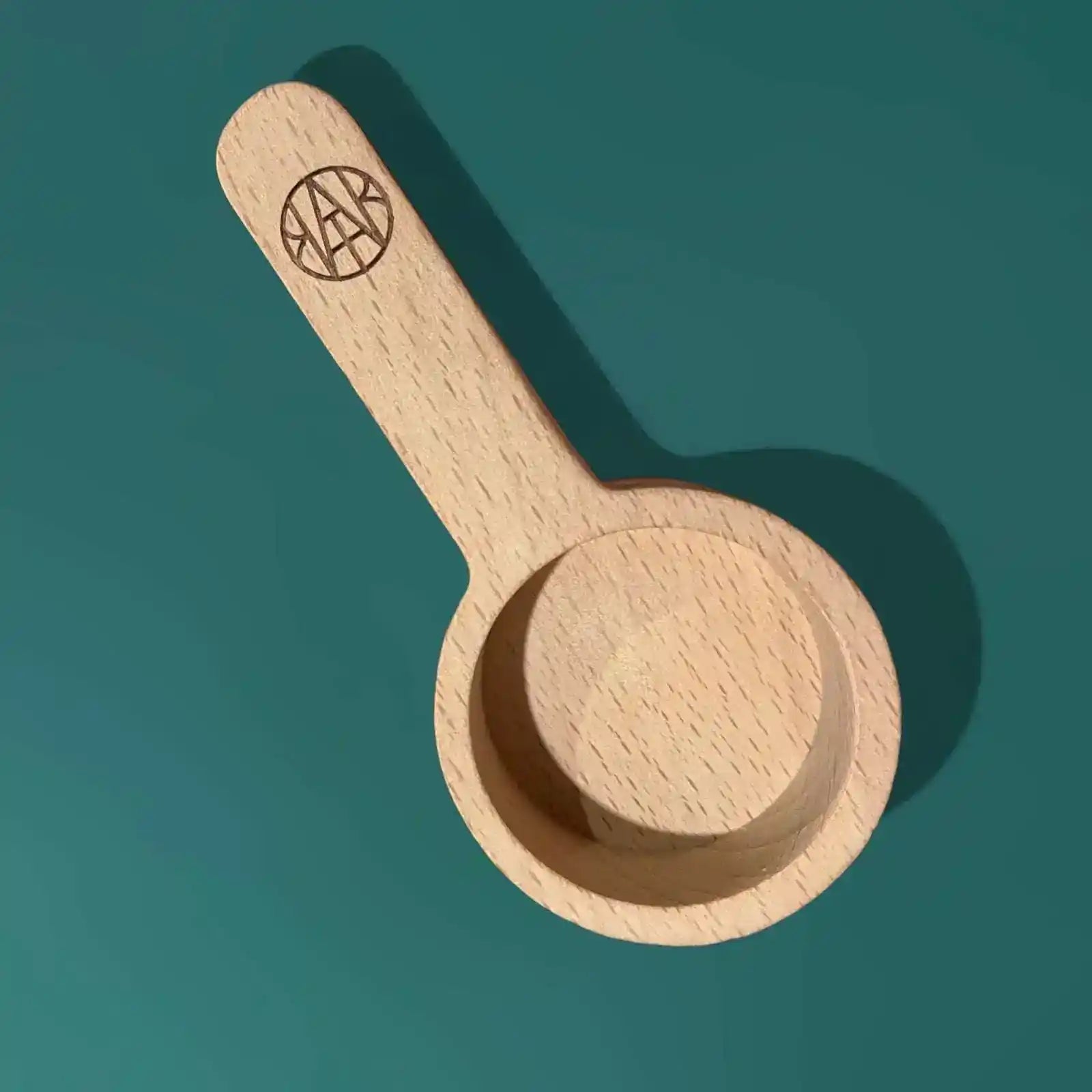 AEMBR laundry scoop made of durable plastic, shown in a neutral color, ideal for measuring and transferring laundry detergent.