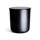 Glossy black candle lid from AEMBR, designed as a deluxe lid for candles, with a smooth, shiny finish.